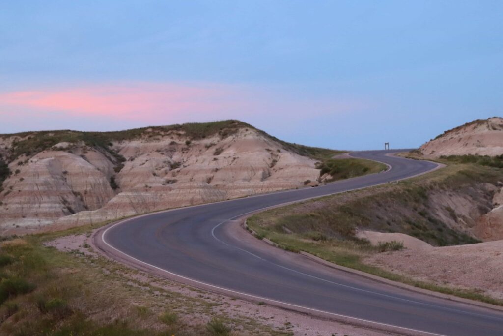 badlands winding road at the blue hour after sunset