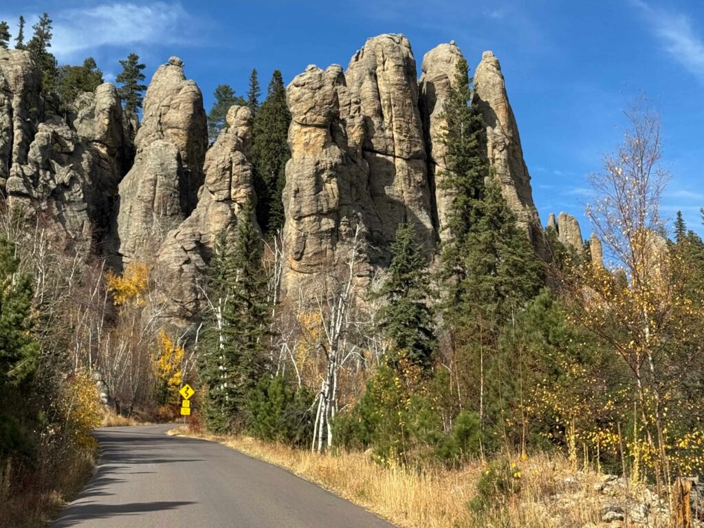 needles highway road approaching giant granite peaks