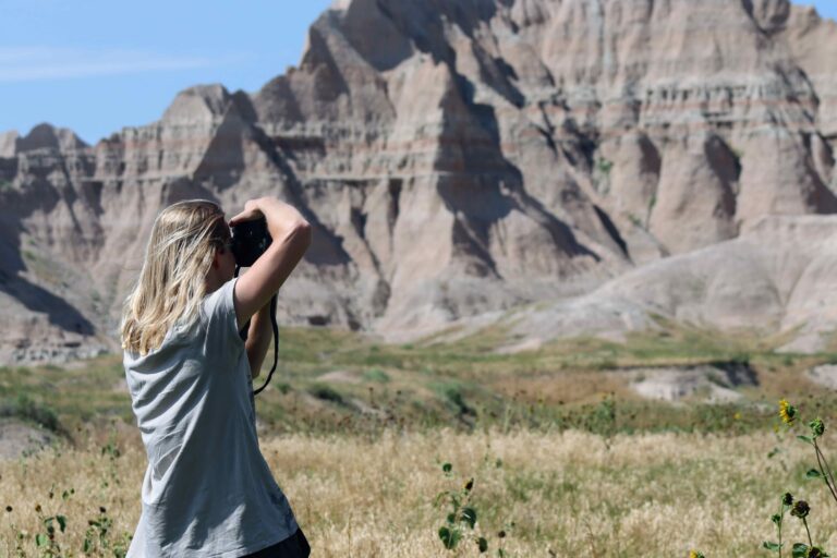 visitor learning to photograph the black hills and badlands