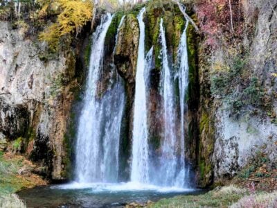 spearfish falls in spearfish canyon with autumn leaves
