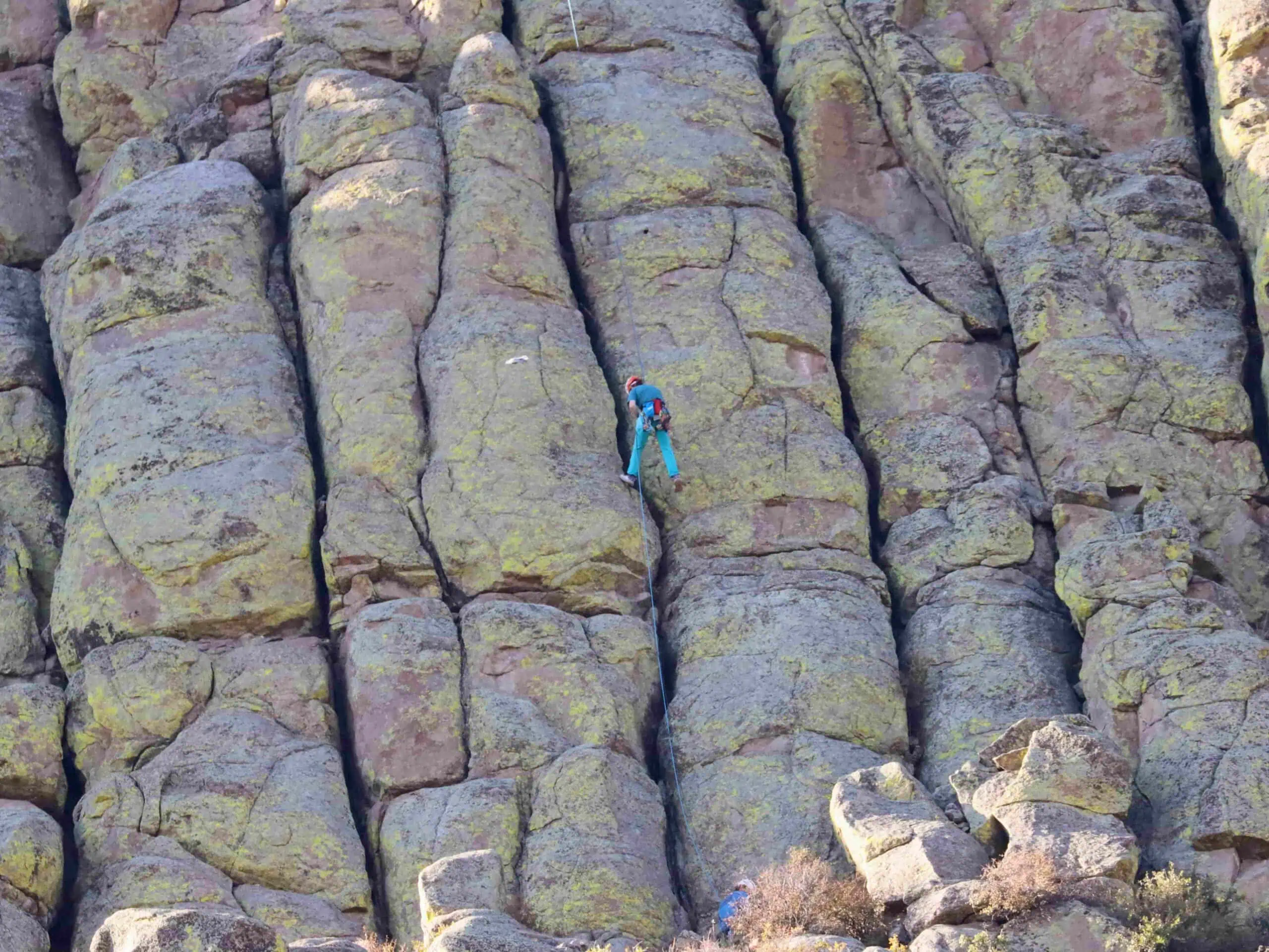 climber on devils tower